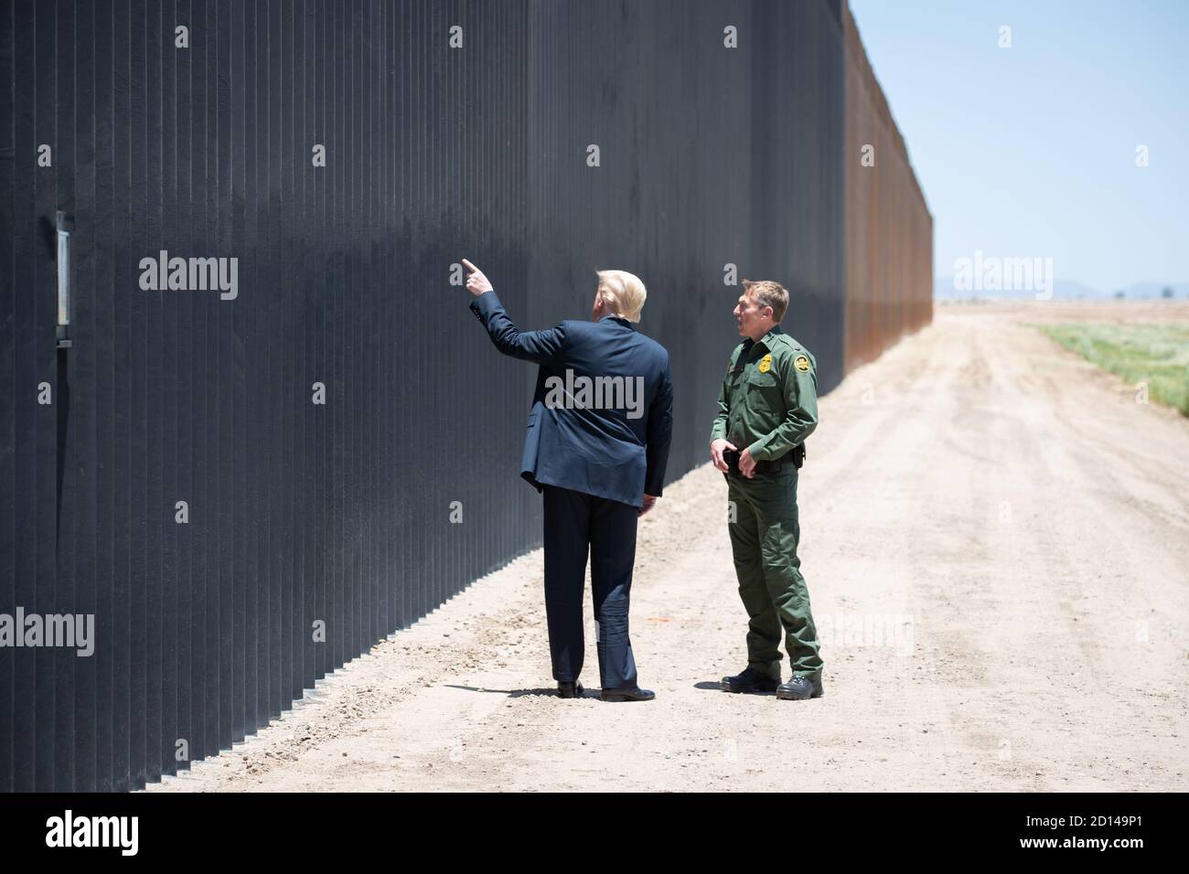 President Donald Trump, along with Acting Secretary Chad Wolf and Acting Commissioner Mark Morgan, visited the border wall in Yuma, Arizona on June 23, 2020. The visit marked the completion of 200 miles of new border wall constructed along the southwest border. Stock Photo