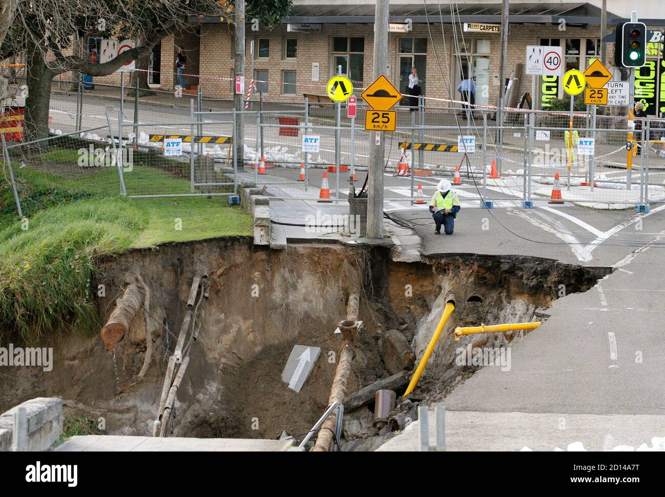 A Council Worker Inspects A 25m 82 Feet Crater Created After A Landslide In Bellevue Hill One Of Sydney S Most Expensive Suburbs May 29 2009 Nobody Was Injured During The Landslide Which