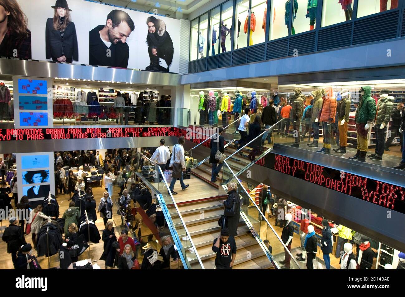 Customers shop inside the casual clothing store Uniqlo operated by Japan's  Fast Retailing in Paris October 6, 2009 after opened in the central  shopping district of the French capital on October 1.