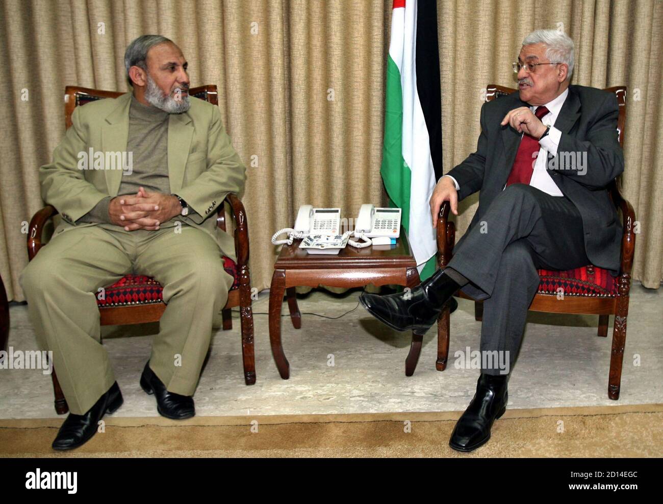 Palestinian President Mahmoud Abbas R Talks To Senior Hamas Leader Mahmoud Al Zahar During Their Meeting At Abbas Office In Gaza City February 4 2006 Three Of Hamas S Top Leaders Al Zahar Ismail Haniyeh