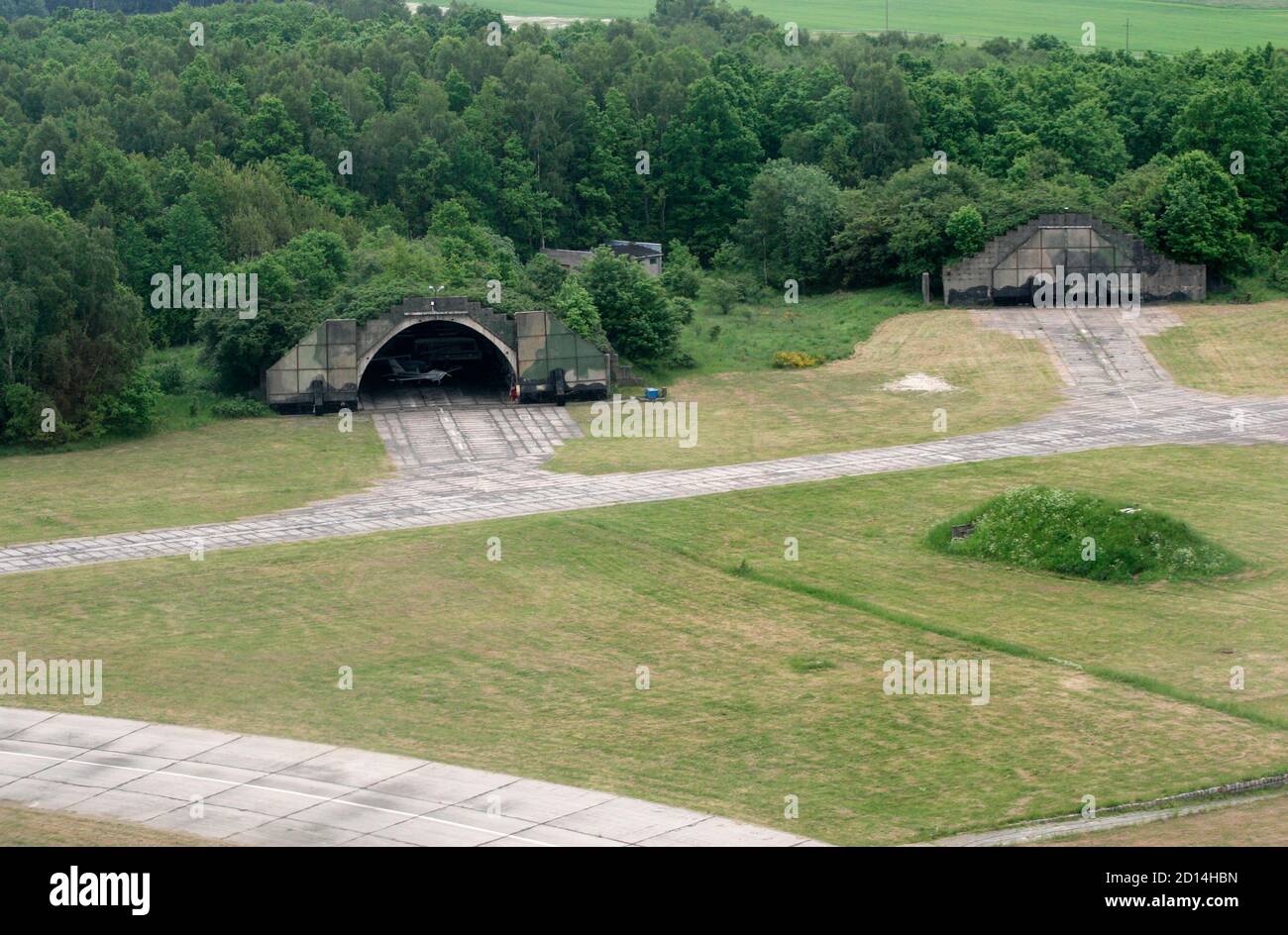 Aerial view of ex-military hangers at an airfield in Redzikowo, near Slupsk, northern Poland, May 27, 2007.The future location of the U.S. anti-missile shield in Poland is still an official secret but in the northern city of Slupsk the locals already know they may live next to it. The facility, which has caused controversy in Europe and anger in Moscow, is a hot topic in Slupsk and nearby Redzikowo, an ex-military airfield poised to house the rocket silos and about 200 U.S. military personnel.   To match feature SHIELD-POLAND/   REUTERS/Kacper Pempel (POLAND) Stock Photo