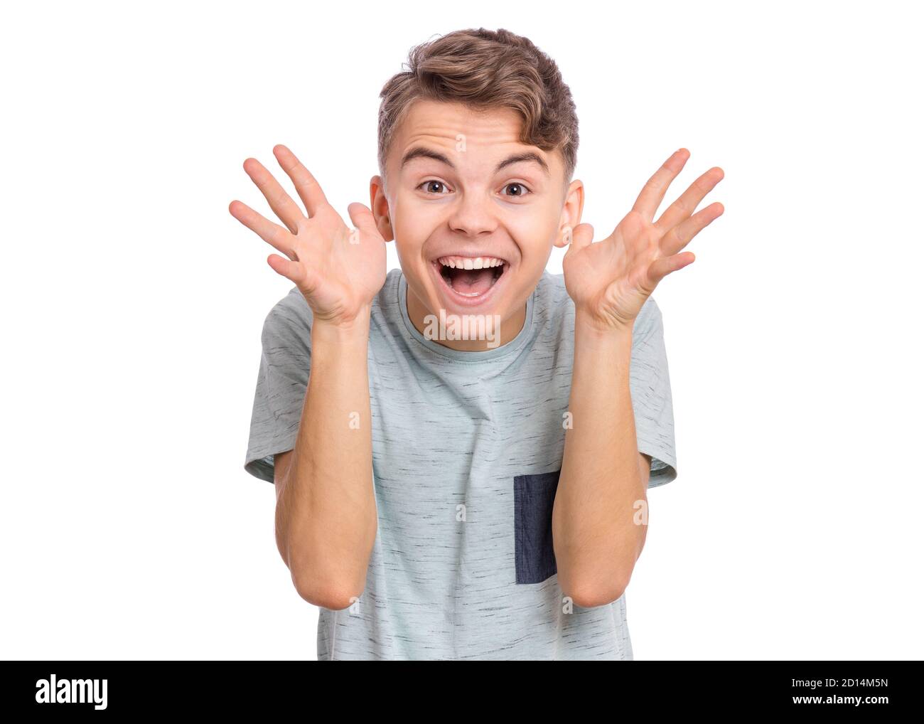 Handsome teen boy laughing looking very happy, isolated on white