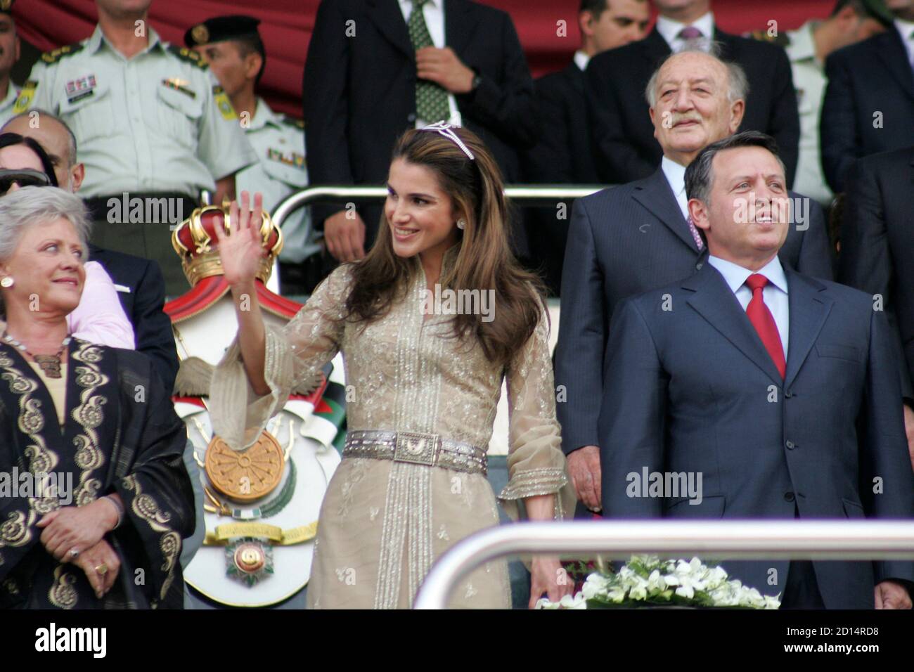 Jordan's King Abdullah (R), his wife Queen Rania (C) and his mother  Princess Muna attend official celebrations of the 10th anniversary of  Abdullah's accession to the throne in Amman June 9, 2009.