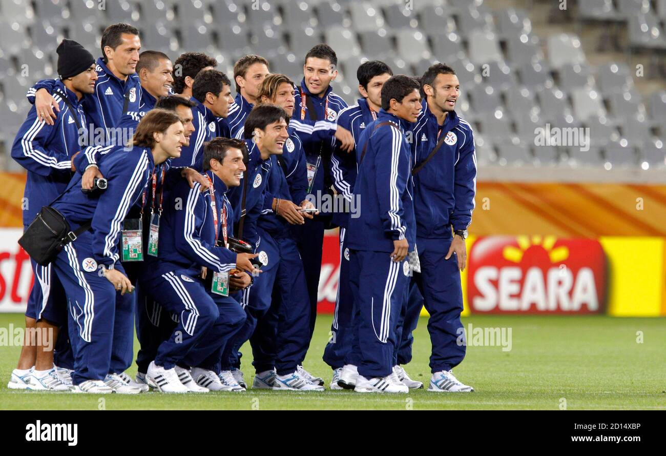 Paraguay's players pose for a group picture during a visit to the Green Point stadium in Cape Town June 13, 2010. REUTERS/Carlos Barria (SOUTH AFRICA - Tags: SPORT SOCCER WORLD CUP) Stock Photo