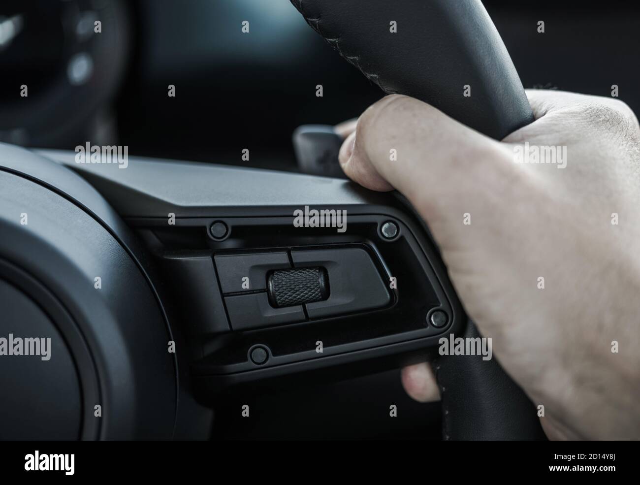 Paddle Shifter Gear Changing by Caucasian Driver Steering Wheel Close Up. Automotive Theme Stock