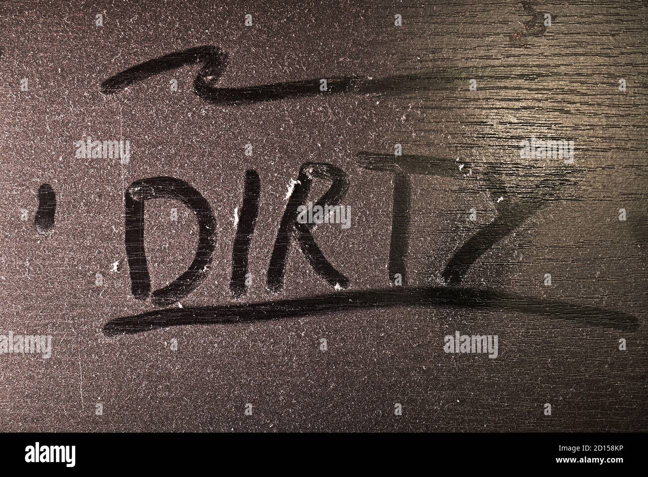 Dust on a table surface with inscription Stock Photo