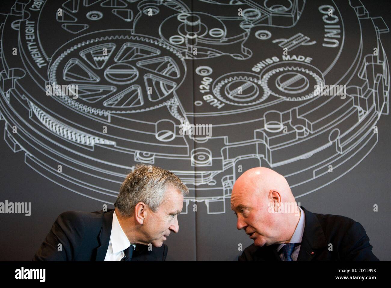 LVMH Moet Hennessy Louis Vuitton chairman and CEO Bernard Arnault (L) and  Swiss watchmaker Hublot CEO Jean-Claude Biver talk during a news conference  after the official inauguration of the Hublot manufacture in