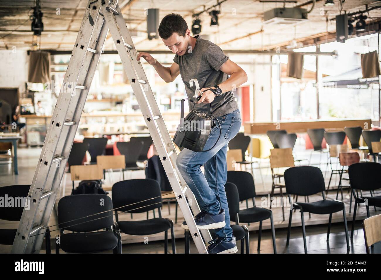 Behind the scene Lighting technician electric engineer adjusting stage