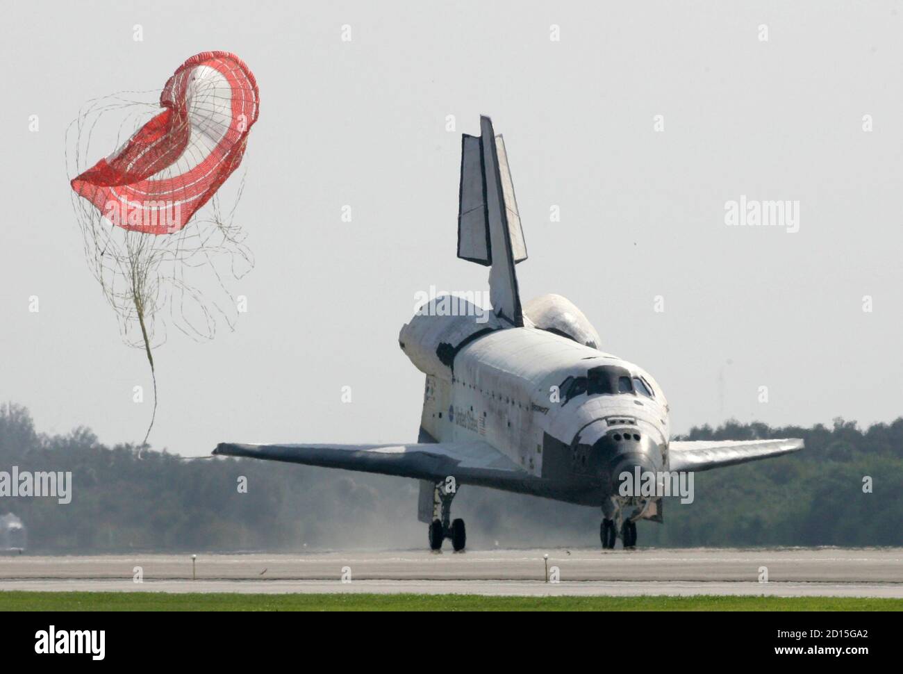 The space shuttle Discovery's drag parachute breaks loose after the