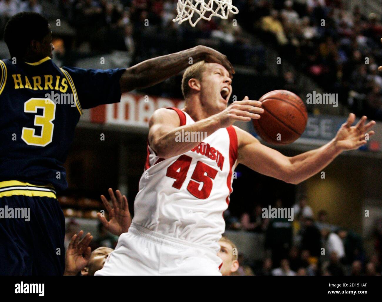 University of Michigan guard Manny Harris (L) and University of Wisconsin  forward Joe Krabbenhoft battle for the ball during the second half of their  Big Ten mens basketball tournament game in Indianapolis