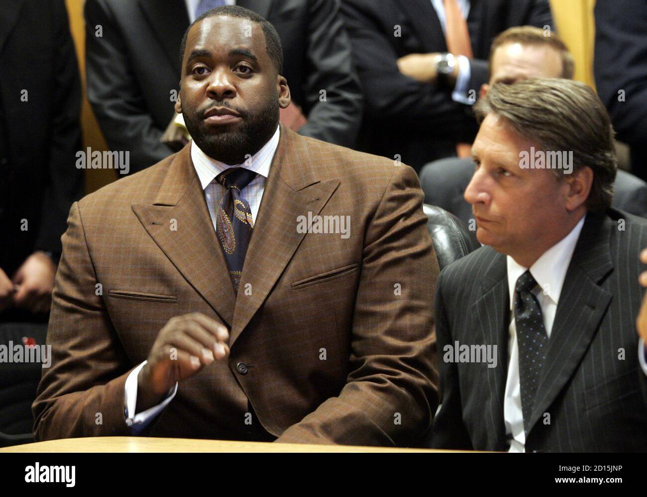 Detroit Mayor Kwame Kilpatrick (L) sits next to his attorney James Thomas during a hearing at Wayne County Circuit Court in Detroit, Michigan September 4, 2008. Kilpatrick pleaded guilty on Thursday to obstruction of justice in a plea agreement that will force him from office and cap a scandal that had threatened to spill over into the U.S. presidential campaign in a key battleground state.    REUTERS/Rebecca Cook   (UNITED STATES) Stock Photo