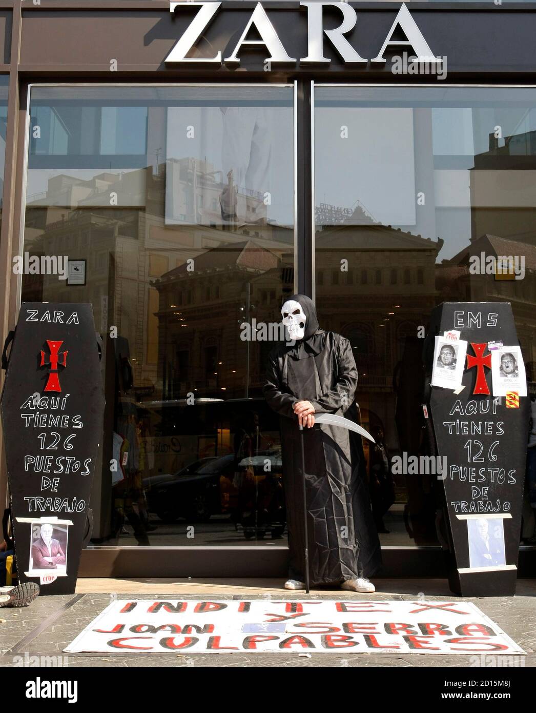 An Inditex worker dressed as death stands outside a Zara shop during a  protest against Inditex group job cuts at Passeig de Gracia in central  Barcelona March 19, 2009. REUTERS/Gustau Nacarino (SPAIN