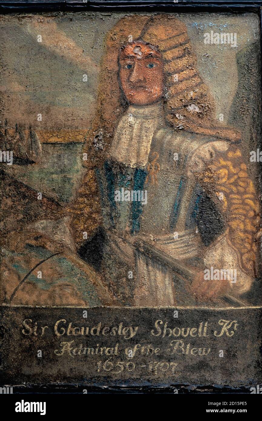 Peeling copy (since replaced) of 1600s portrait by Flemish history artist Willem de Ryck (1635-1699) of British Admiral of the Fleet Sir Cloudesley Shovell (c. 1650-1707), which hung until its renewal in All Saints Street, in the Old Town at Hastings, East Sussex, England, UK.  It hung outside ‘Shovells’, a 15th century timber-framed Tudor cottage believed to have been the home of Sir Cloudesley’s mother, Anne Shovell. Stock Photo