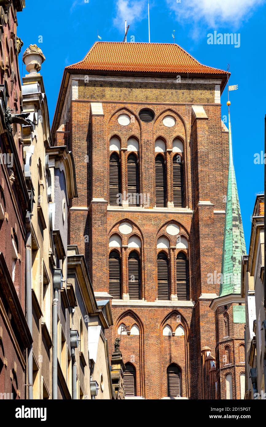 Gdansk, Pomerania / Poland - 2020/07/14: Twin towers of St. Mary’s Basilica - Bazylika Mariacka - seen from Kaletnicza street in the historic old town Stock Photo