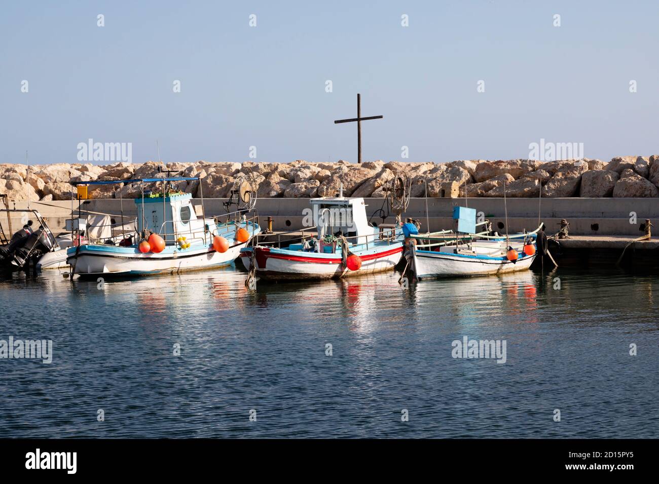 Traditional Cypriot fishing boats moored in Xylotymvou fishing shelter, Dhekelia Sovereign Base Area, Larnaca, Cyprus Stock Photo