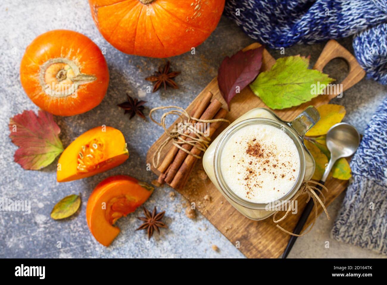 Picture of Autumn pumpkin spiced latte or coffee in glass with organic ingredients ...