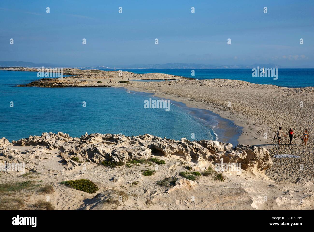 Spain, Balearic islands, formentera, platja de ses illetes, people walking on the fine sandy beach bathed in clear water Stock Photo