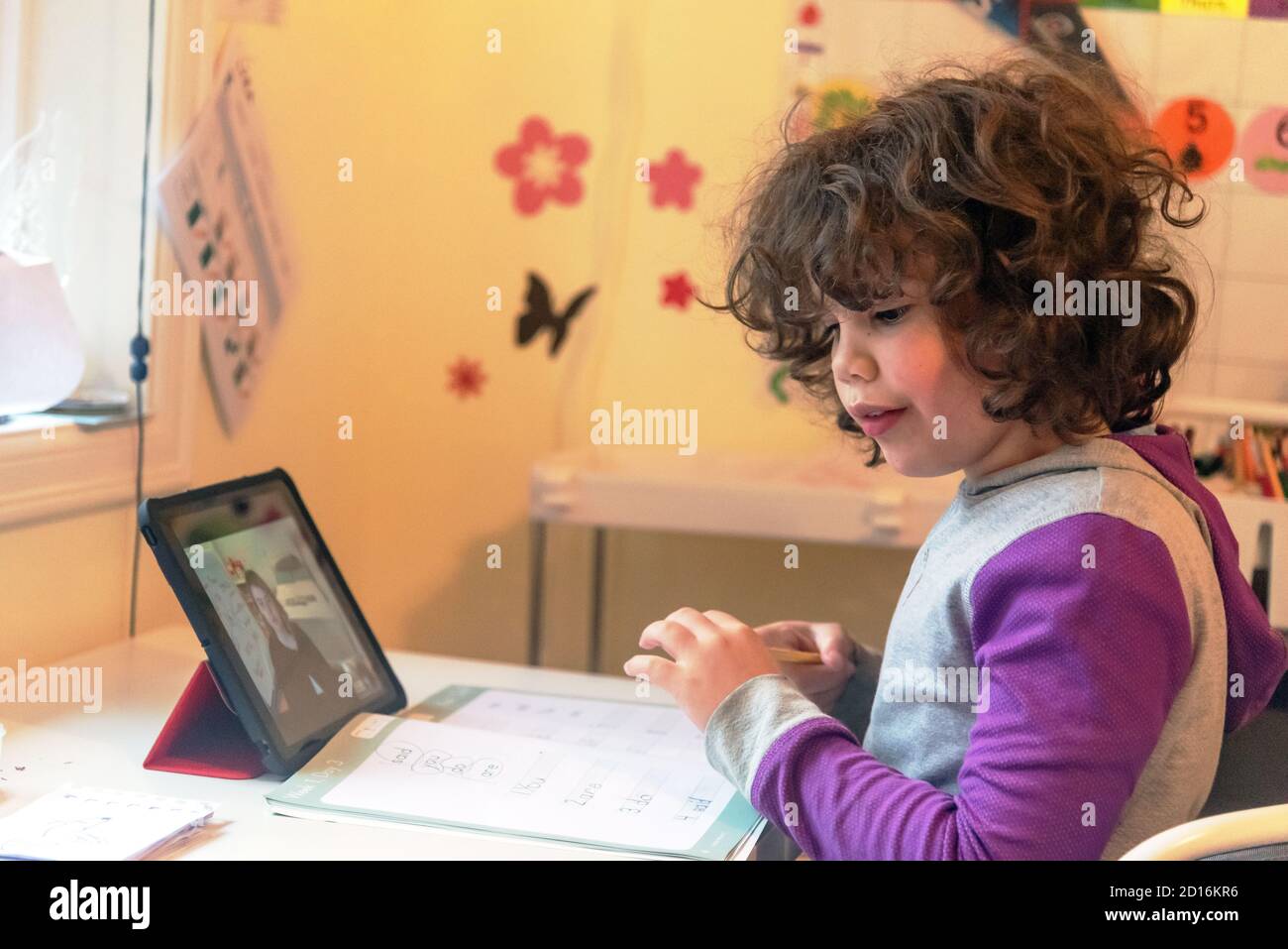 2nd grade student during distance learning class, Washington state, USA Stock Photo