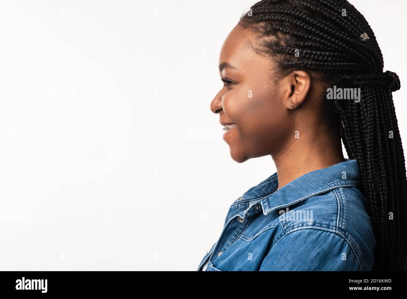 African Lady With Braided Hairstyle Posing Over White Background, Side-View  Stock Photo - Alamy