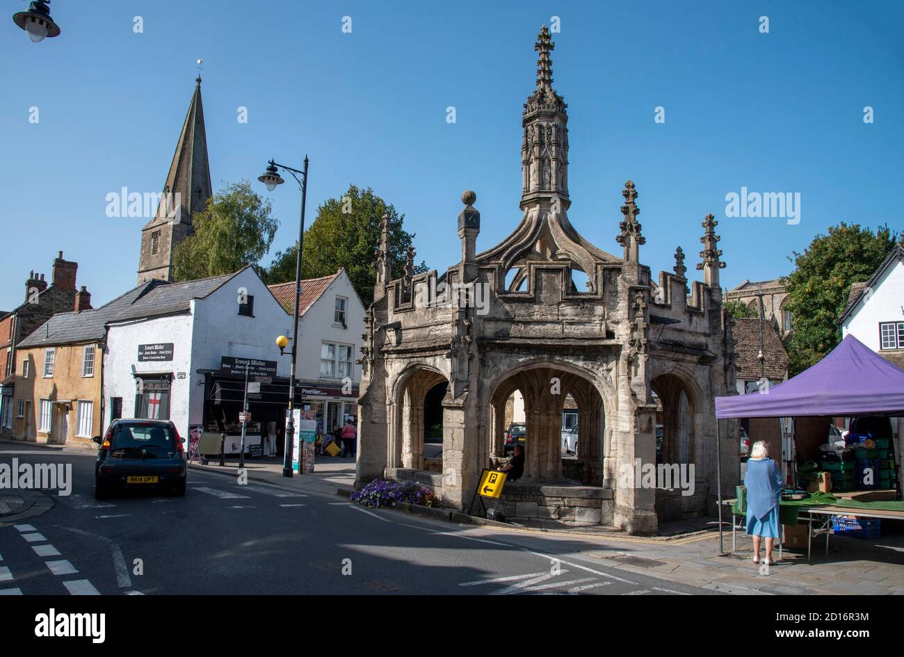 Malmesbury, Wiltshire, England, UK. 2020.  The market cross and St Pauls church in Malmesbury town centre. Stock Photo