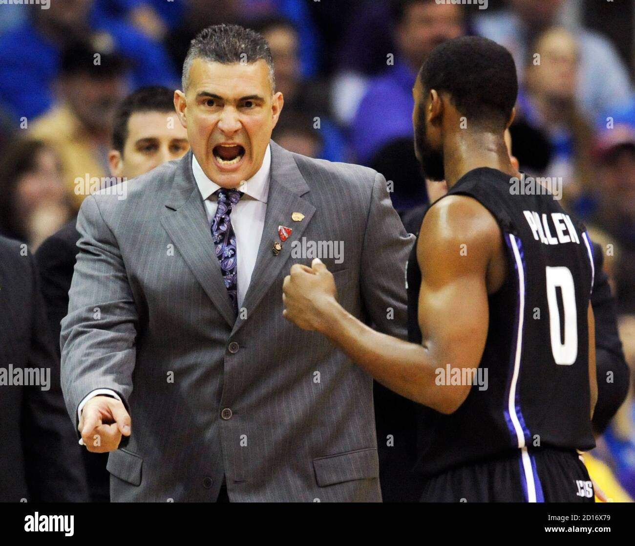 Kansas State Wildcats head coach Frank Martin chews out guard Jacob Pullen  during the first half of the Kansas Jayhawks' win in the final game of the  NCAA men's Big 12 Basketball