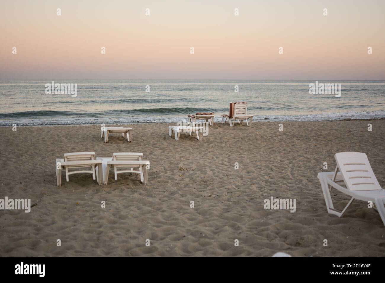 Beach Chairs End Of The Beach Season Plastic Beach Deck Chair On An Empty Beach At Sunset Stock Photo Alamy