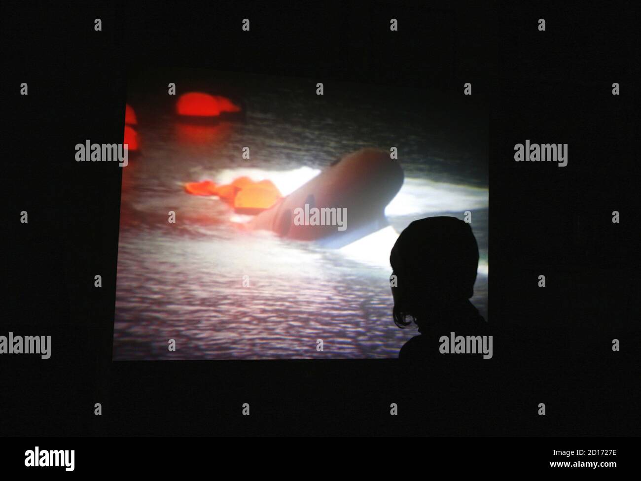 A Woman Watches On Greek Tv News About The Cruise Ship Sea Diamond Sinking Near The Island Of Santorini April 6 2007 The Sea Diamond Sank Shortly Before 7 A M 0400gmt And