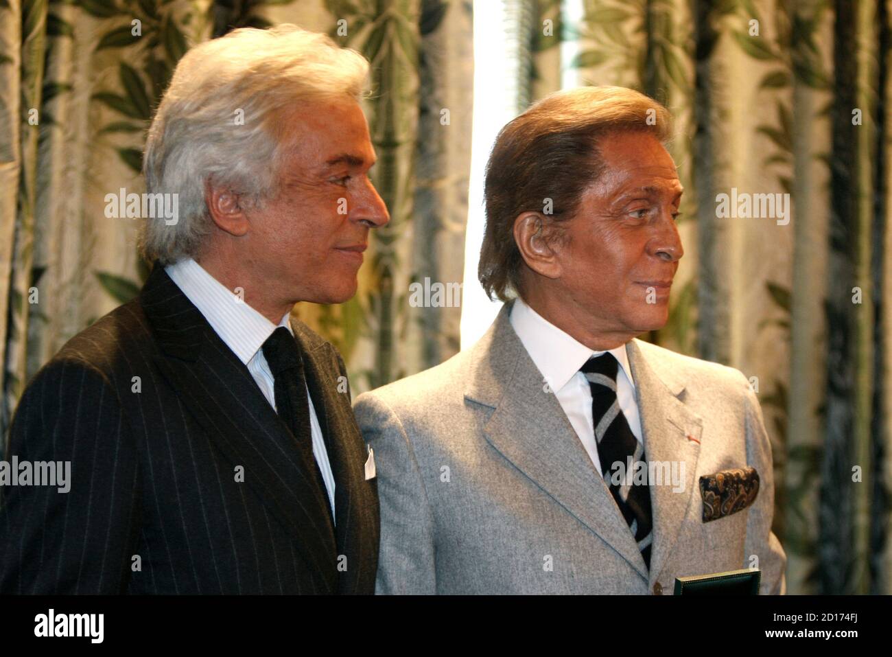 Italian designer Valentino (R) attends a ceremony with his business partner  Giancarlo Giammetti where Valentino was awarded the Medal of Paris at the  Hotel de Ville in the French capital, January 24,