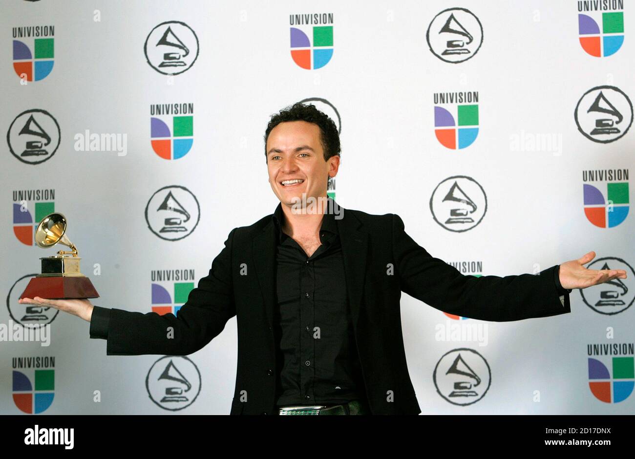 Juan Fernando Fonseca holds his award for Best Tropical Song for Juan Fernando Fonseca holds his award for Best Tropical Song for