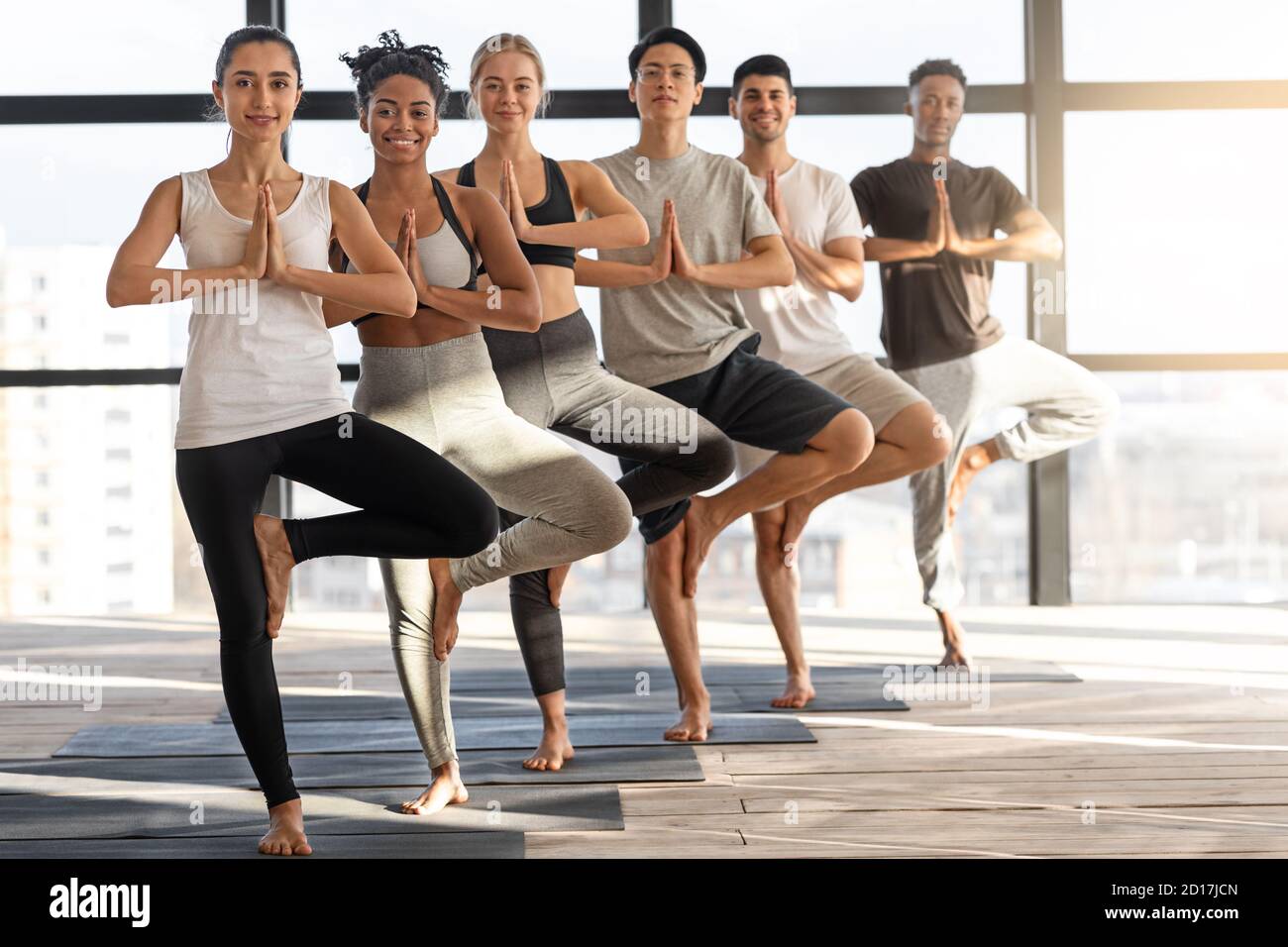 Group of Young People Practice Yoga Together Stock Image - Image of health,  flexibility: 193102427