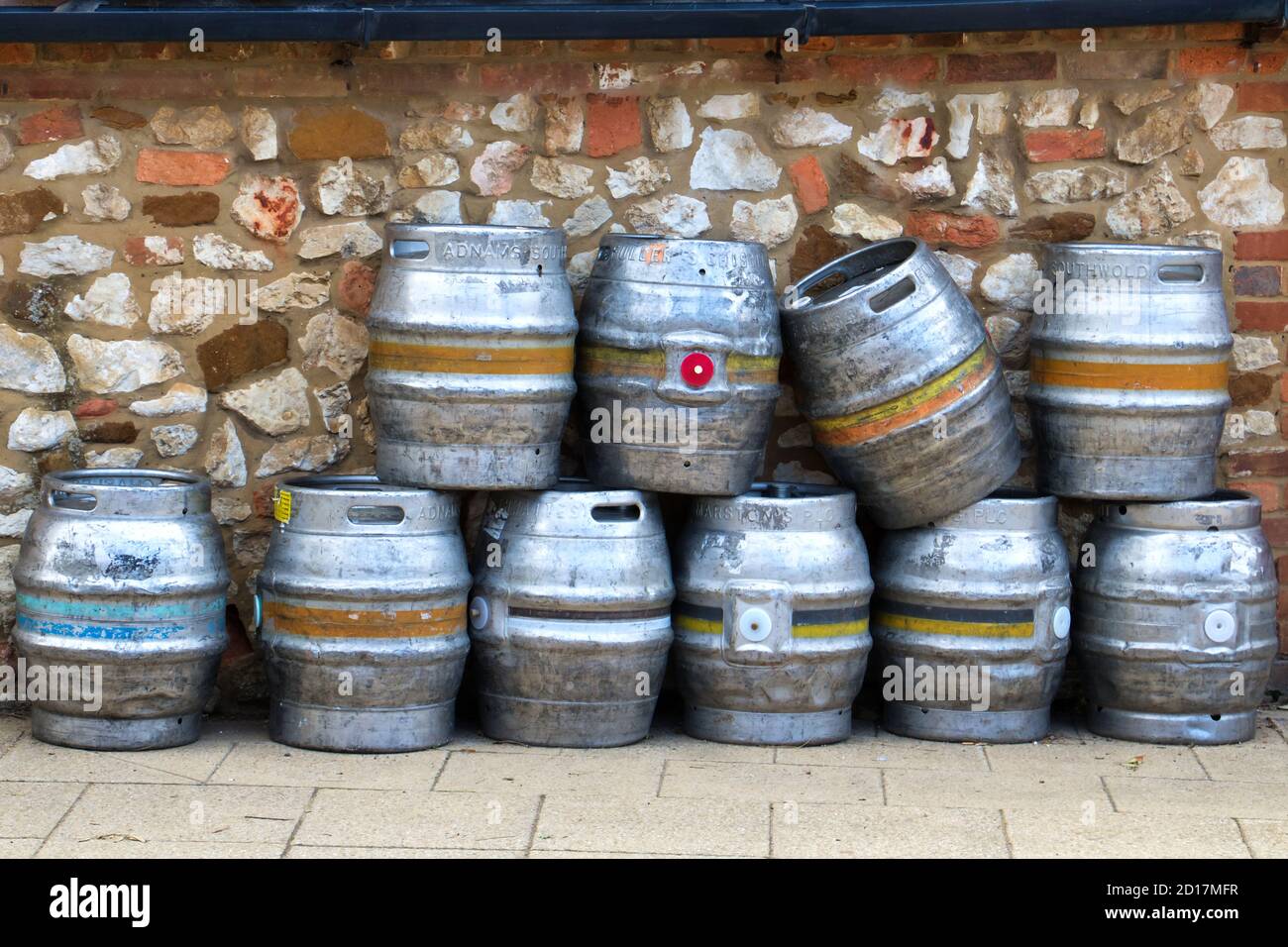 Metal beer barrels stacked outside a pub in Old Hunstanton, Norfolk Stock Photo