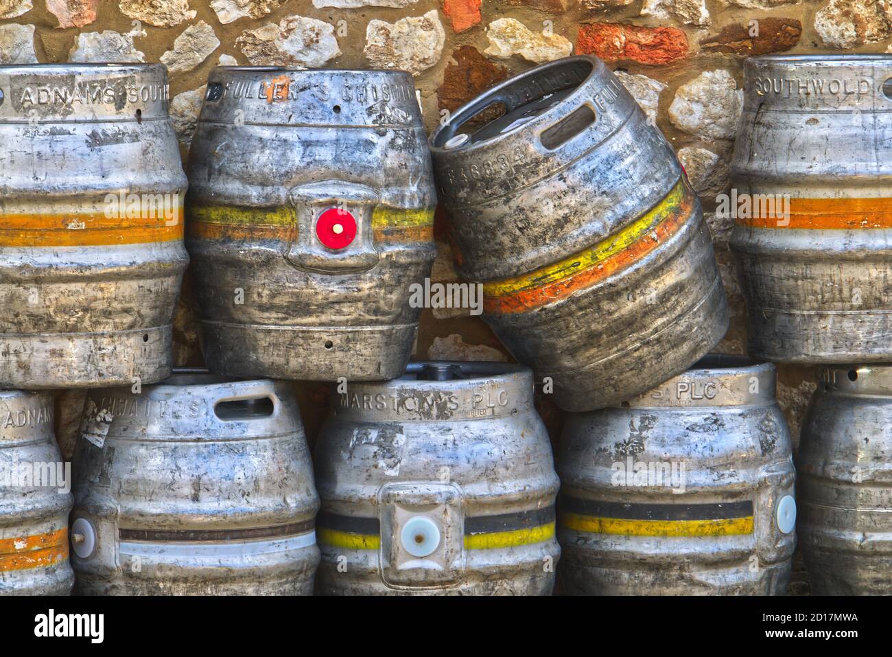Metal beer barrels stacked outside a pub in Old Hunstanton, Norfolk Stock Photo
