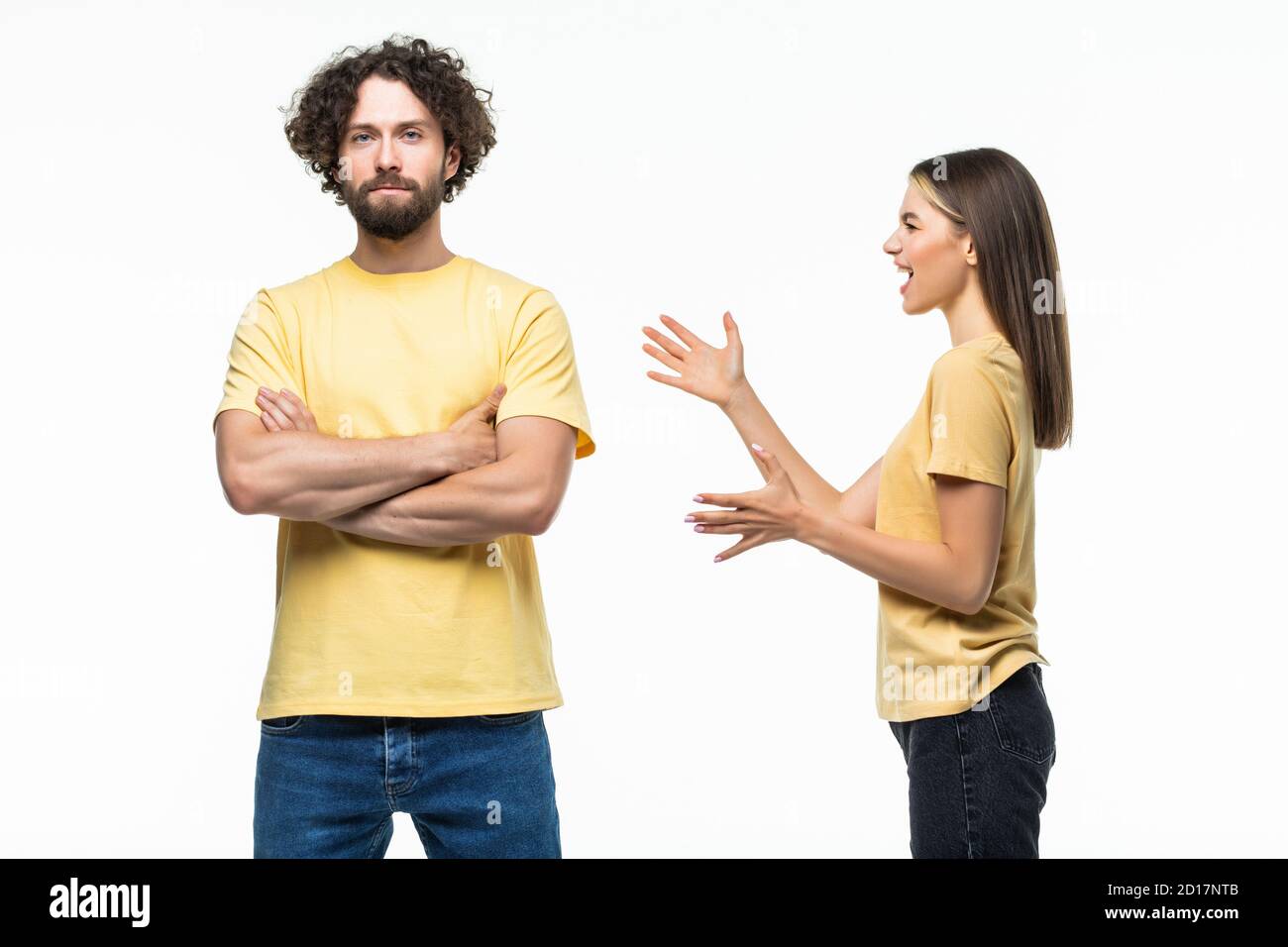 Closeup portrait of young angry couple, man, woman, screaming at each other, blaming for problem, isolated on white background. Marriage difficulties Stock Photo