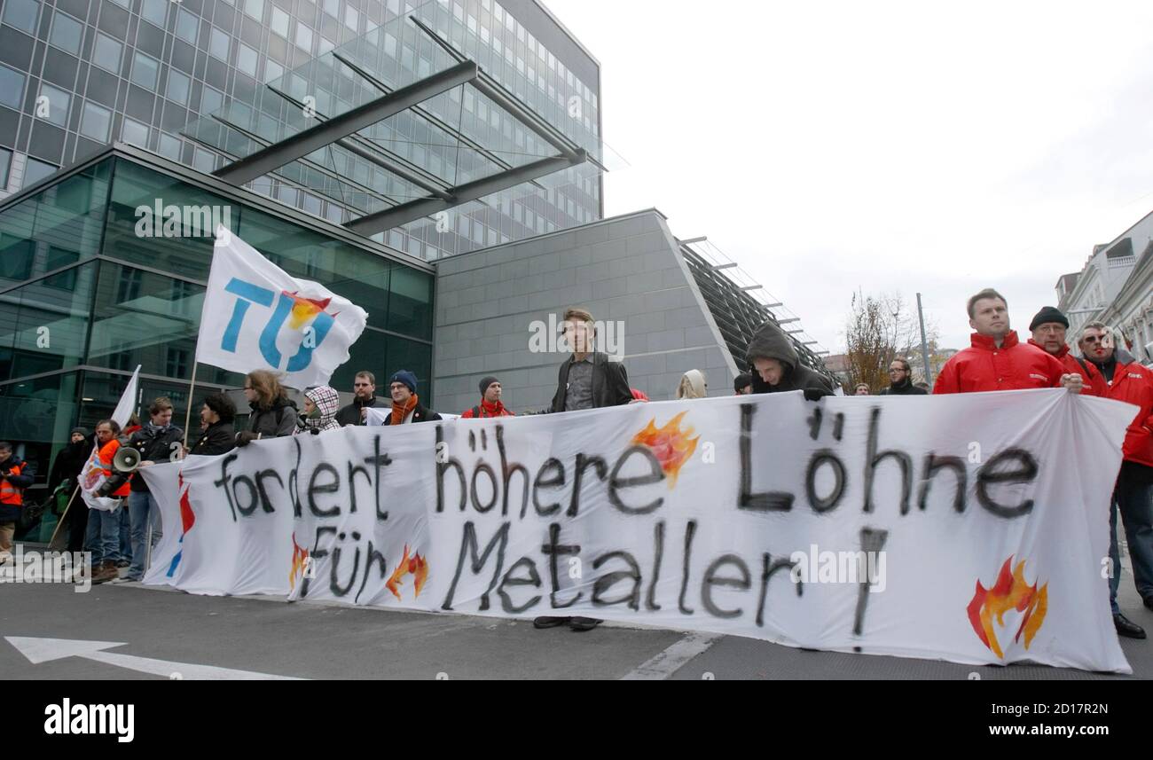 Students and union members demonstrate in Vienna November 12, 2009. 'TU fordert hoehere Loehne fuer Metaller' reads 'Technical University demands higher salaries for metal workers'. REUTERS/Heinz-Peter Bader  (AUSTRIA - Tags: POLITICS EMPLOYMENT BUSINESS) Stock Photo
