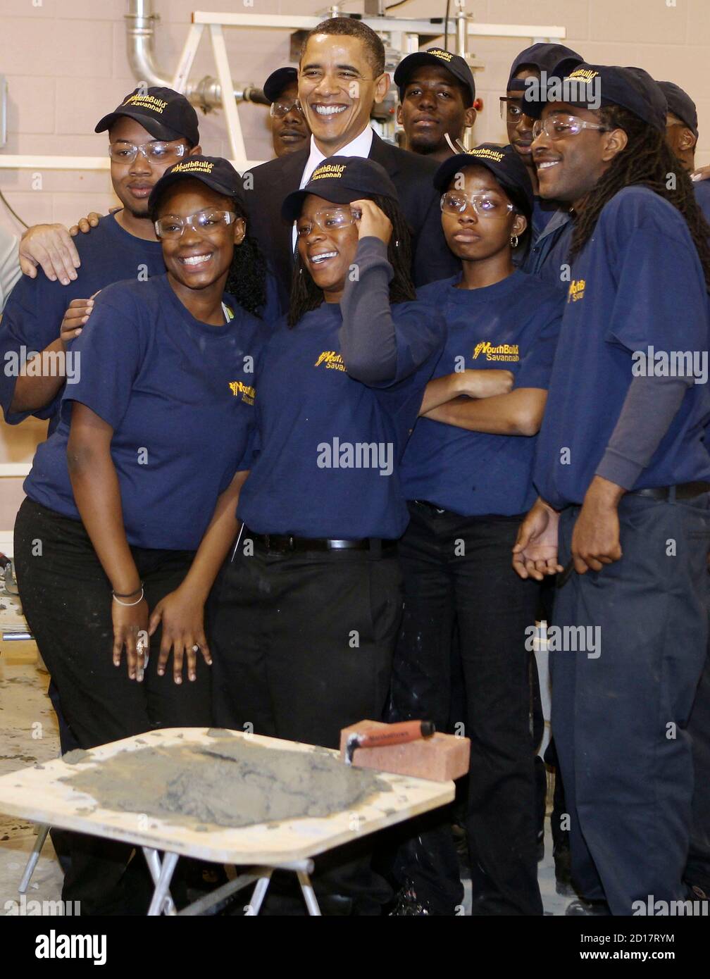 U.S. President Barack Obama pose for a picture with students during his  visit at the Youth Build Program in Savannah Technical College in Savannah,  Georgia, March 2, 2010. REUTERS/Larry Downing (UNITED STATES -