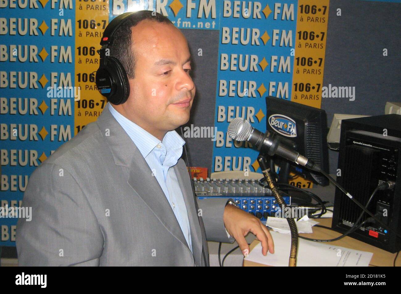 Ahmed el Keiy chats with listeners calling his nightly Ramadan radio  programme at the Paris radio station Beur FM, popular with French-born sons  and daughters of North African immigrants, September 25, 2007.