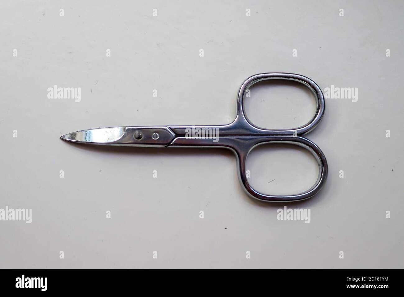 Manicure scissors closeup on white background Stock Photo Alamy