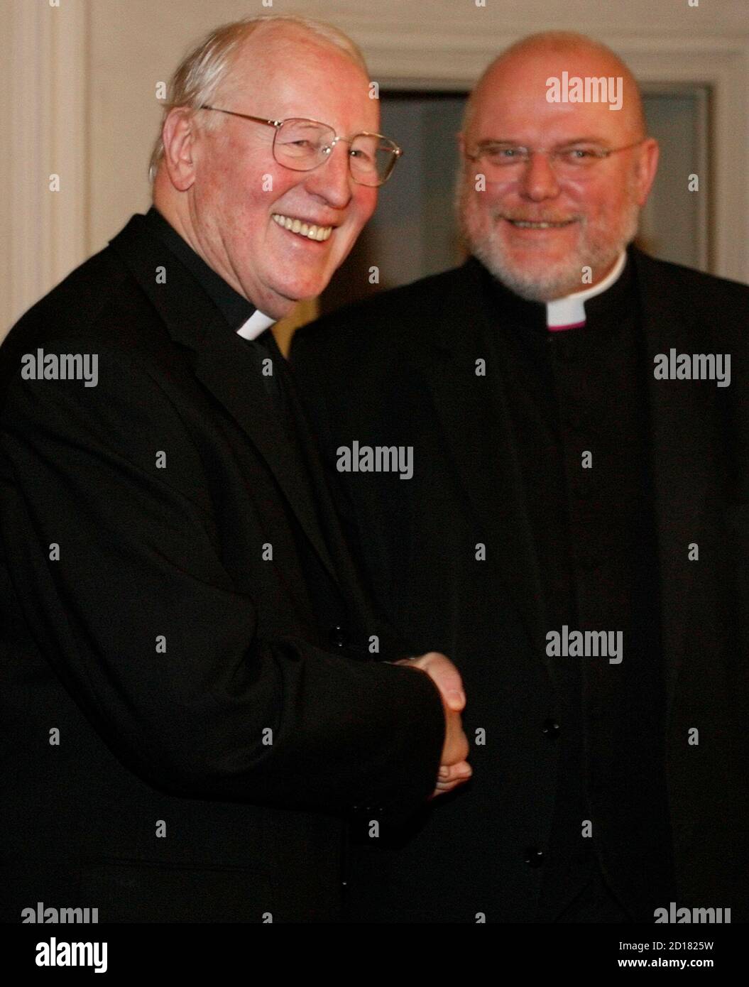 Reinhard Marx Bishop of Trier and Munich's Cardinal and archbishop Friedrich Wetter (R) pose for the media in Munich December 6, 2007. Marx will be the successor of Wetter after Pope Benedict XVI granted the request of Wetter for resignation.  REUTERS/Michael Dalder    (GERMANY) Stock Photo