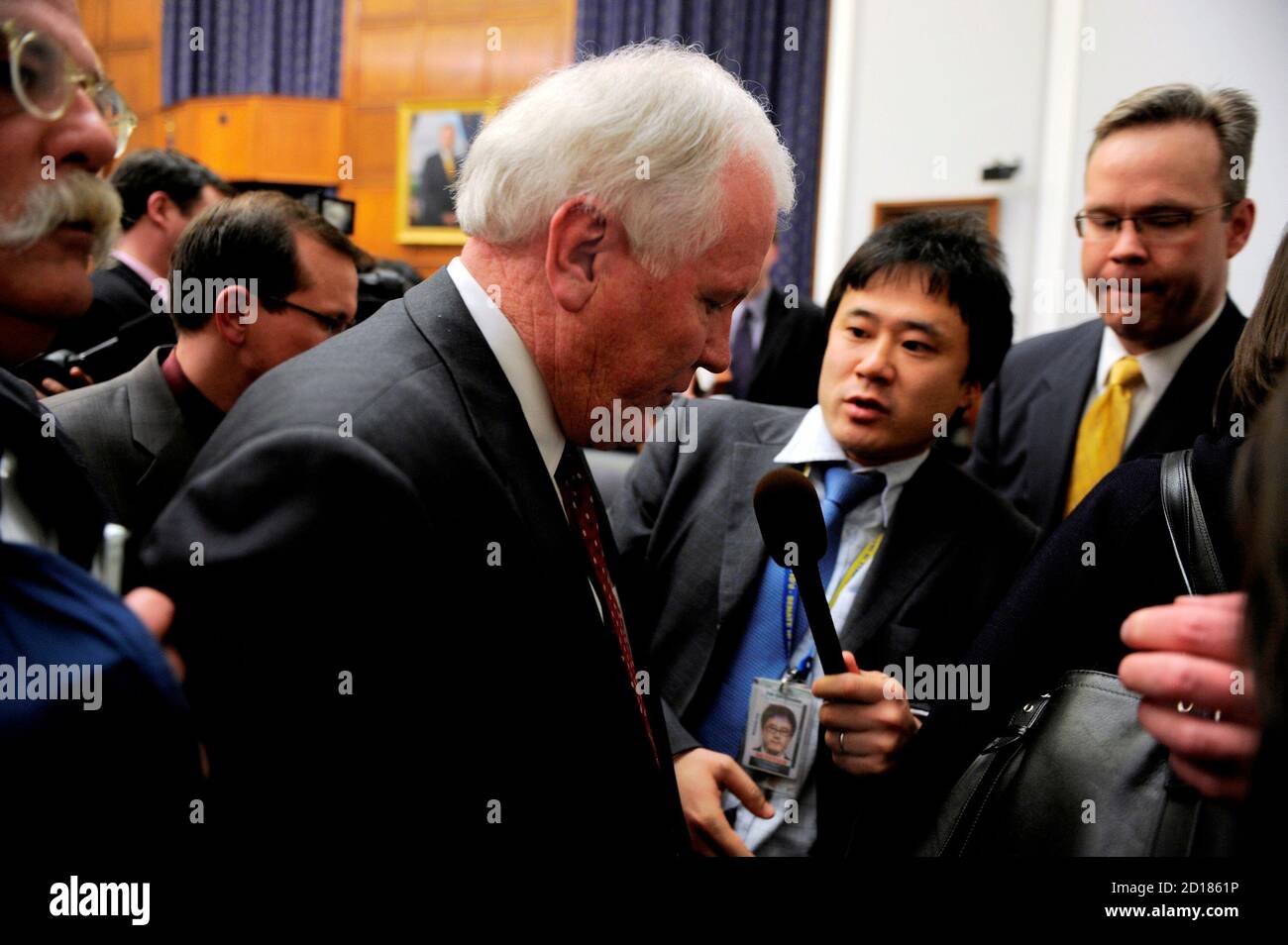 AIG CEO Edward Liddy makes his way through journalists as he departs after testifying before the House Financial Services Subcommittee on Capital Markets, Insurance, and Government Sponsored Enterprises on Capitol Hill in Washington March 18, 2009. The hearing was on 'American International Group's Impact on the Global Economy: Before, During, and After Federal Intervention'. The U.S. House of Representatives, reacting to public furor, will vote on Thursday on a bill to recoup most of the bonuses paid to AIG executives after the insurer got billions of dollars in government aid, Democratic lea Stock Photo