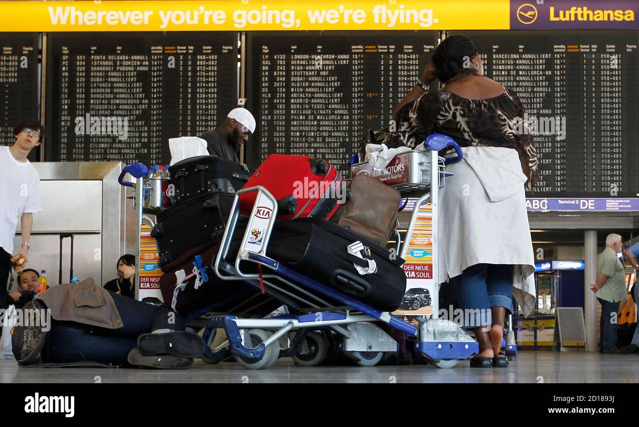 Passengers Stand In Front Of An Information Board At Frankfurt S Airport April 18 2010 Two German