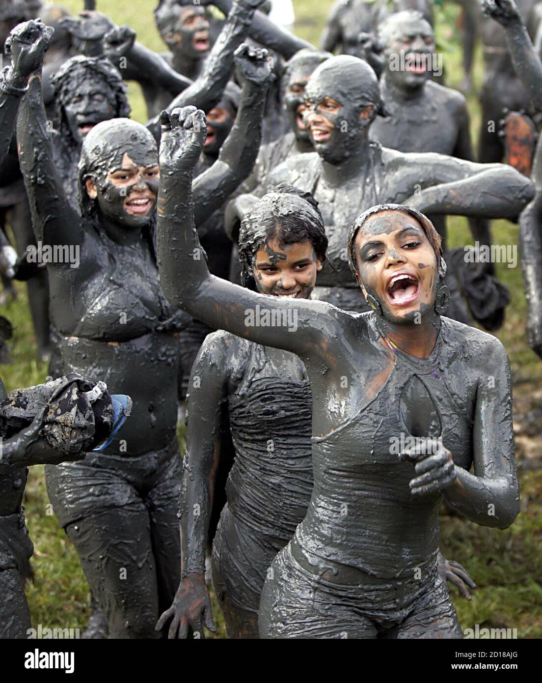 Members of the "Bloco da Lama" (Block of Mud) group perform near Jabaquara  beach in the city of Paraty, 263 km (163 miles) from [Rio de Janeiro]  February 25, 2006. During Carnival,
