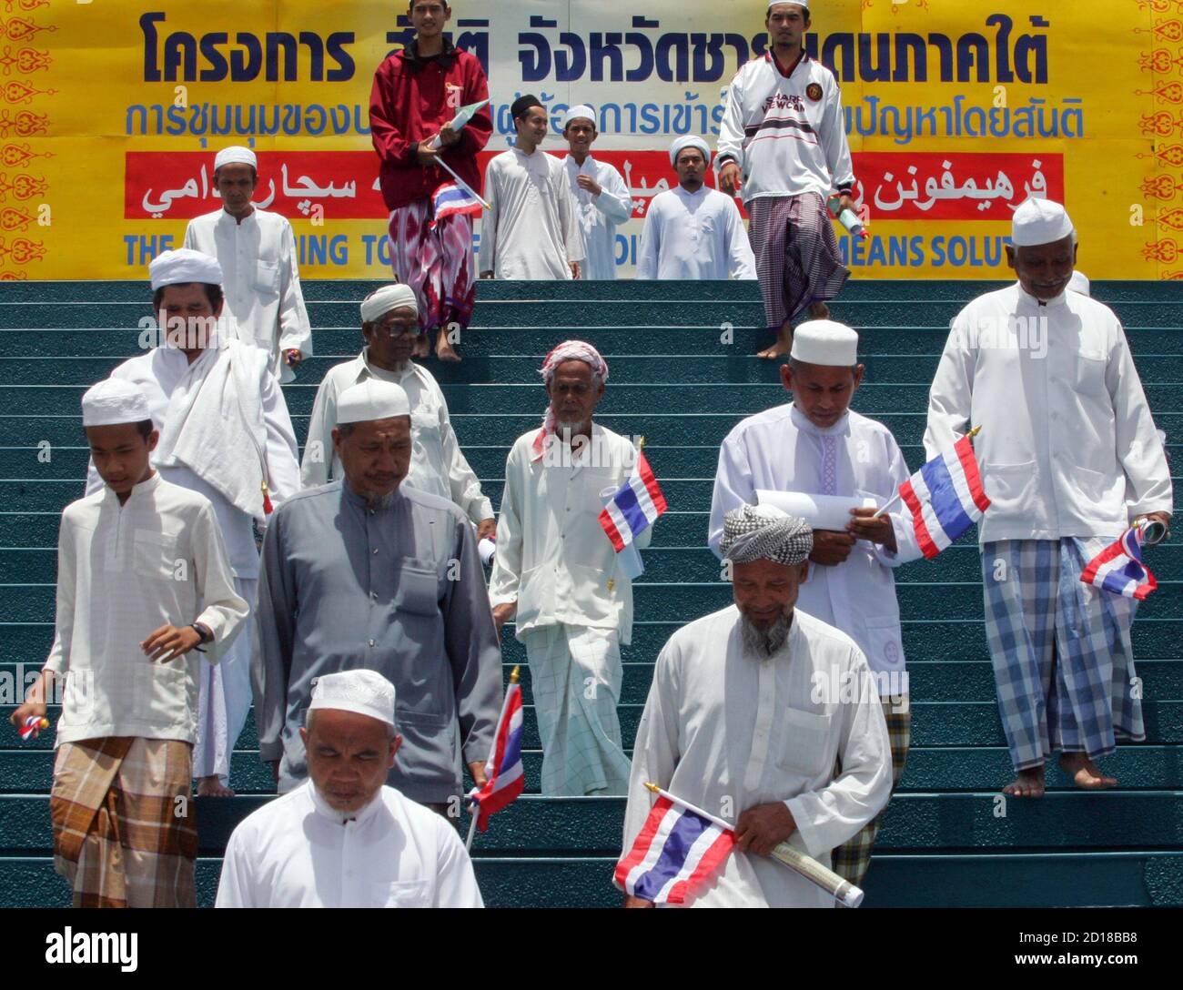 Thais Of Ethnic Malay Descent Hold Their Country S Flags As They Walk Down Steps After A Peace Gathering At Yala Central Mosque In The Troubled Southern Town Of Yala September 16 2006