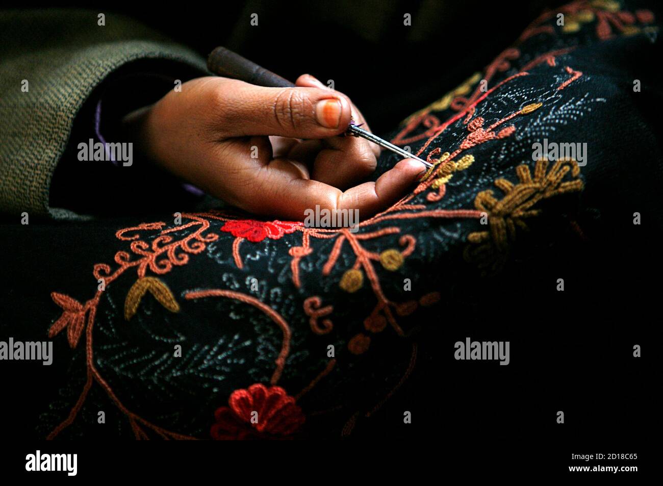 A Kashmiri Woman Embroiders A Shawl Inside A Workshop In Budgam 15 Km 9 Miles West Of Srinagar December 20 2006 The Valley Of Kashmir Is Known For Its Textiles Especially For