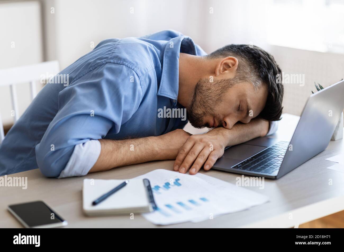 Sleep At Work. Exhausted overworked man employee napping at workplace in  office Stock Photo - Alamy