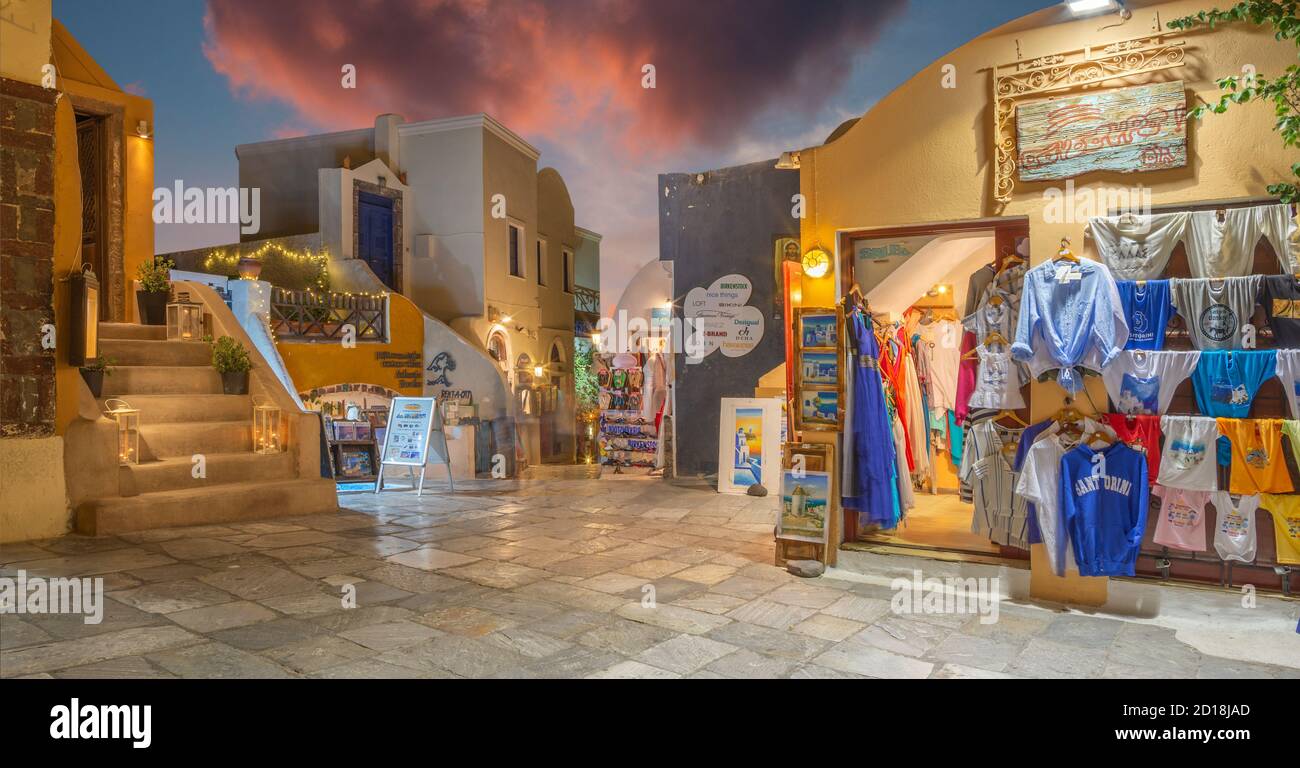 SANTORINI, GREECE - OCTOBER 4, 2015: The street of Oia with the souvenirs shops and restaurants at night. Stock Photo