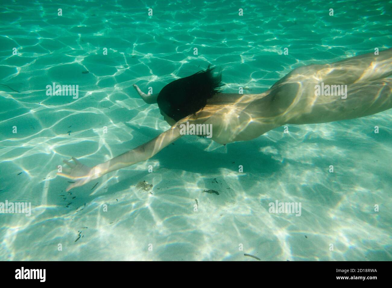 mujer desnuda buceando, Cala Marmols, Ses Salines,mallorca, islas baleares, spain, europa Stock Photo