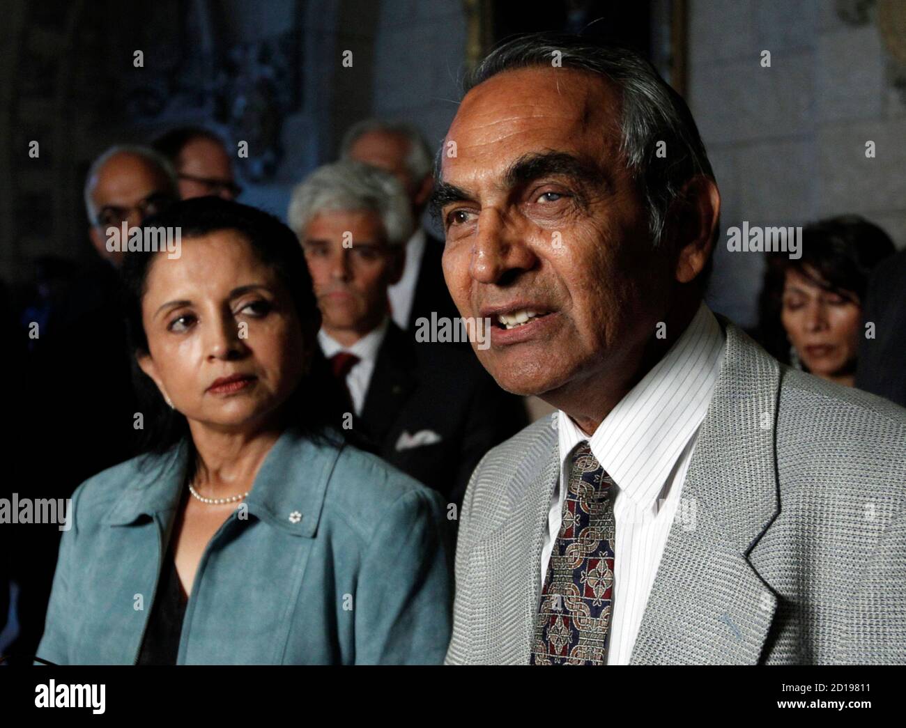 Bal Gupta (R) speaks to journalists with Lata Pada about the final report on the bombing of Air India Flight 182 on Parliament Hill in Ottawa June 17, 2010. Gupta's wife and Pada's husband and two daughters were killed in the bombing. Canada needs a security tsar to avoid the 'cascading series of errors' by intelligence and police agencies that led to the bombing of Air India Flight 182, an inquiry into the case said on Thursday.       REUTERS/Chris Wattie       (CANADA - Tags: TRANSPORT DISASTER POLITICS) Stock Photo