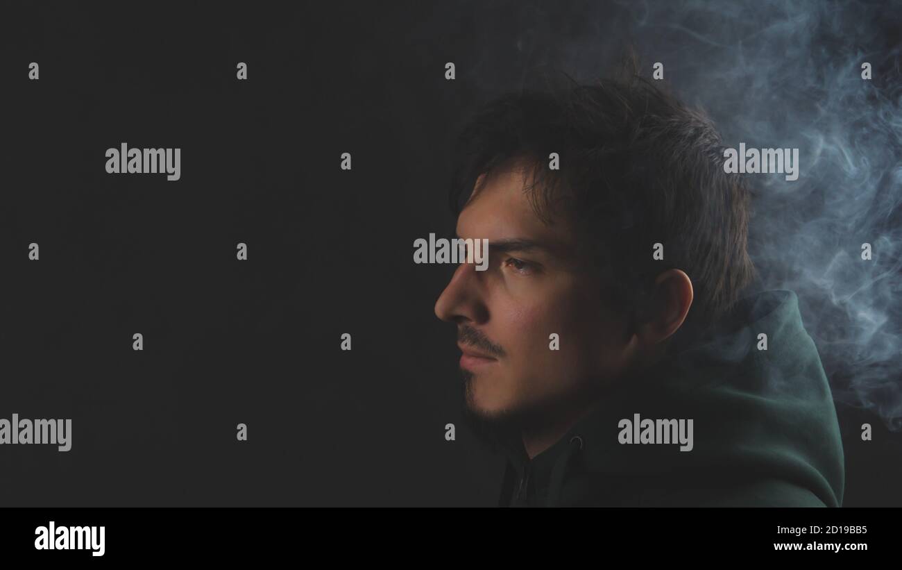 Young man on the black background. male portrait Stock Photo - Alamy