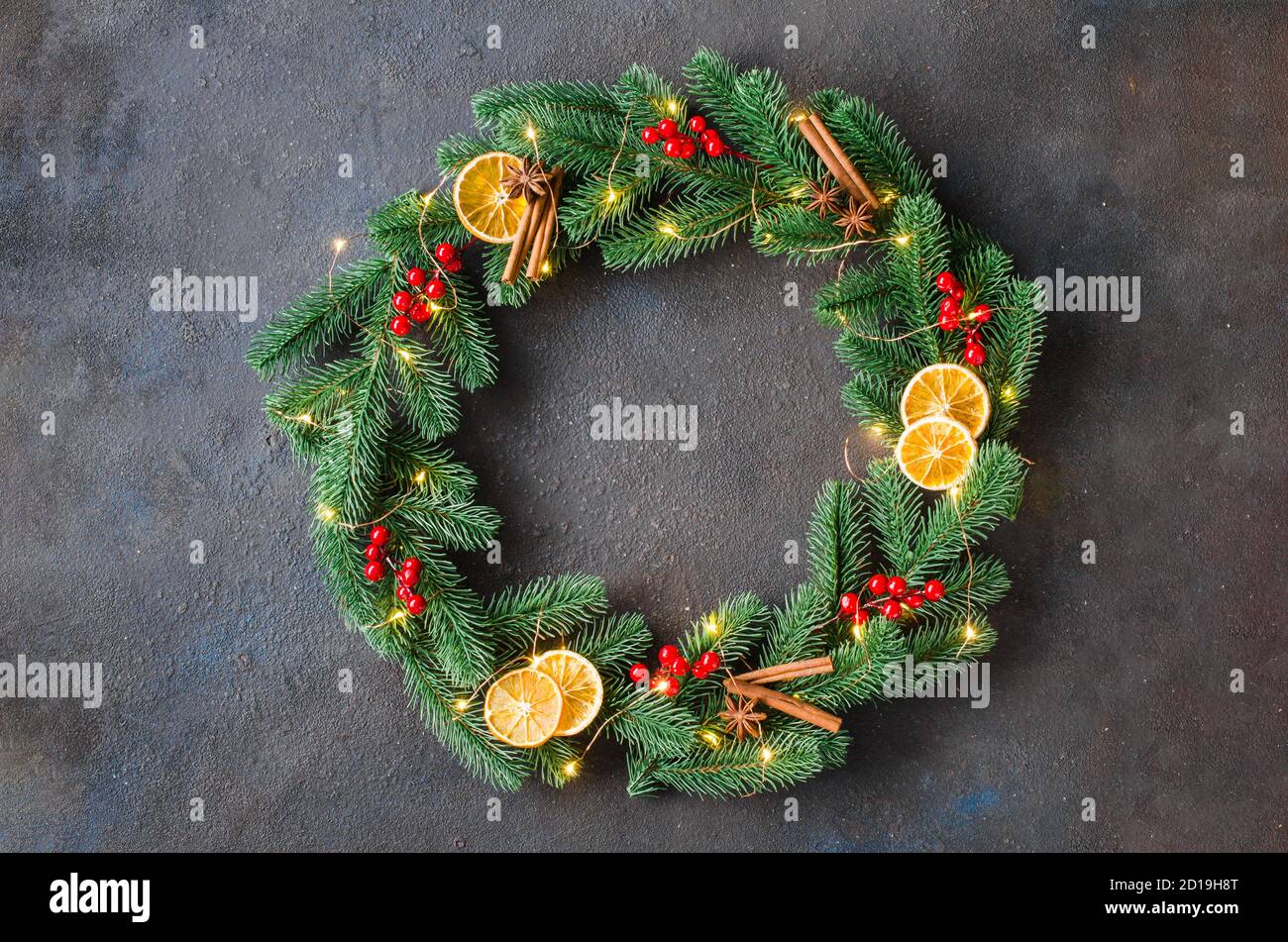 Christmas wreath made of tree fir branches with lights and decorations ...