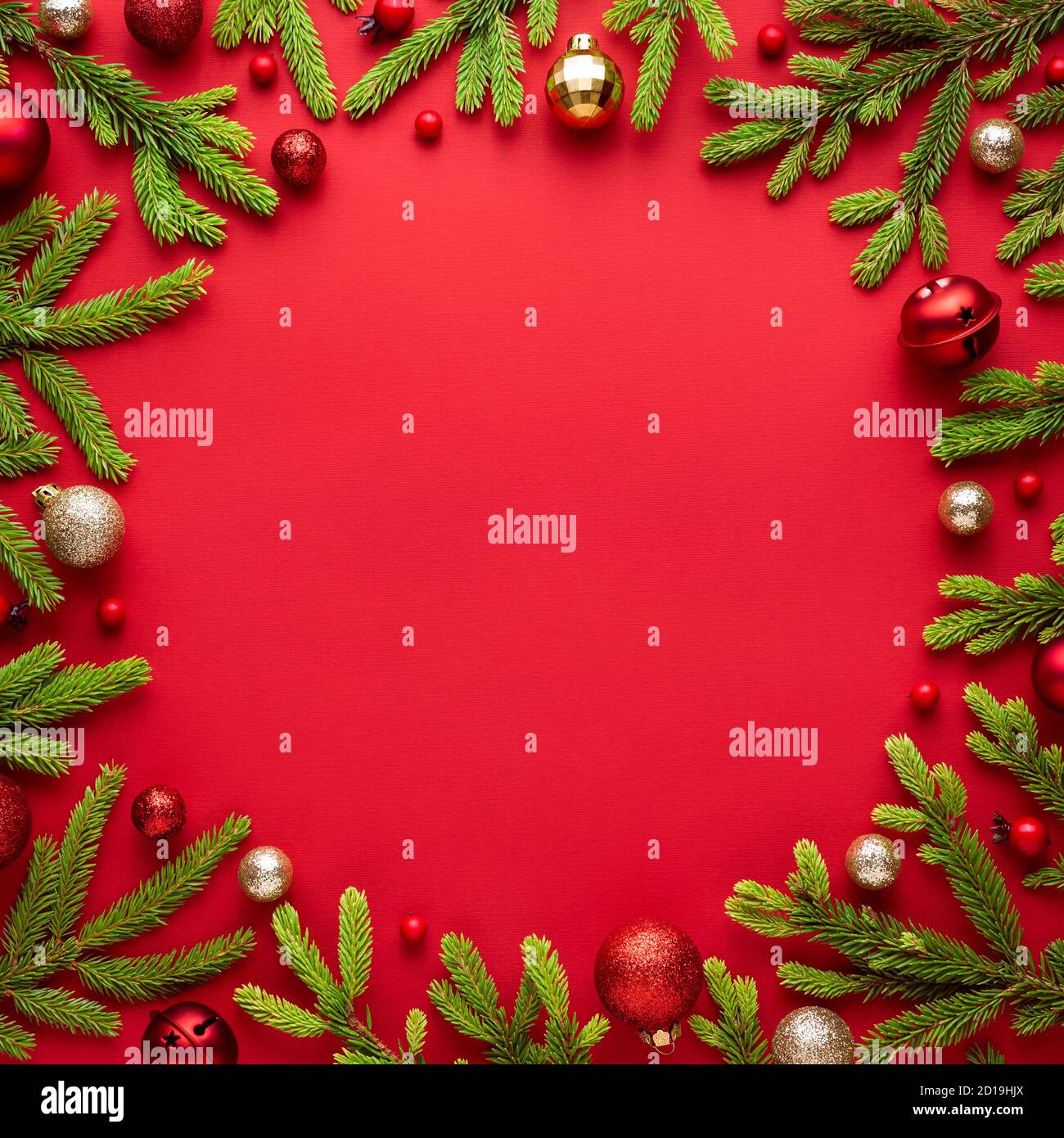 Christmas card with round frame on red background. Festive border with copy space for advertising text. Top view, flat lay Stock Photo